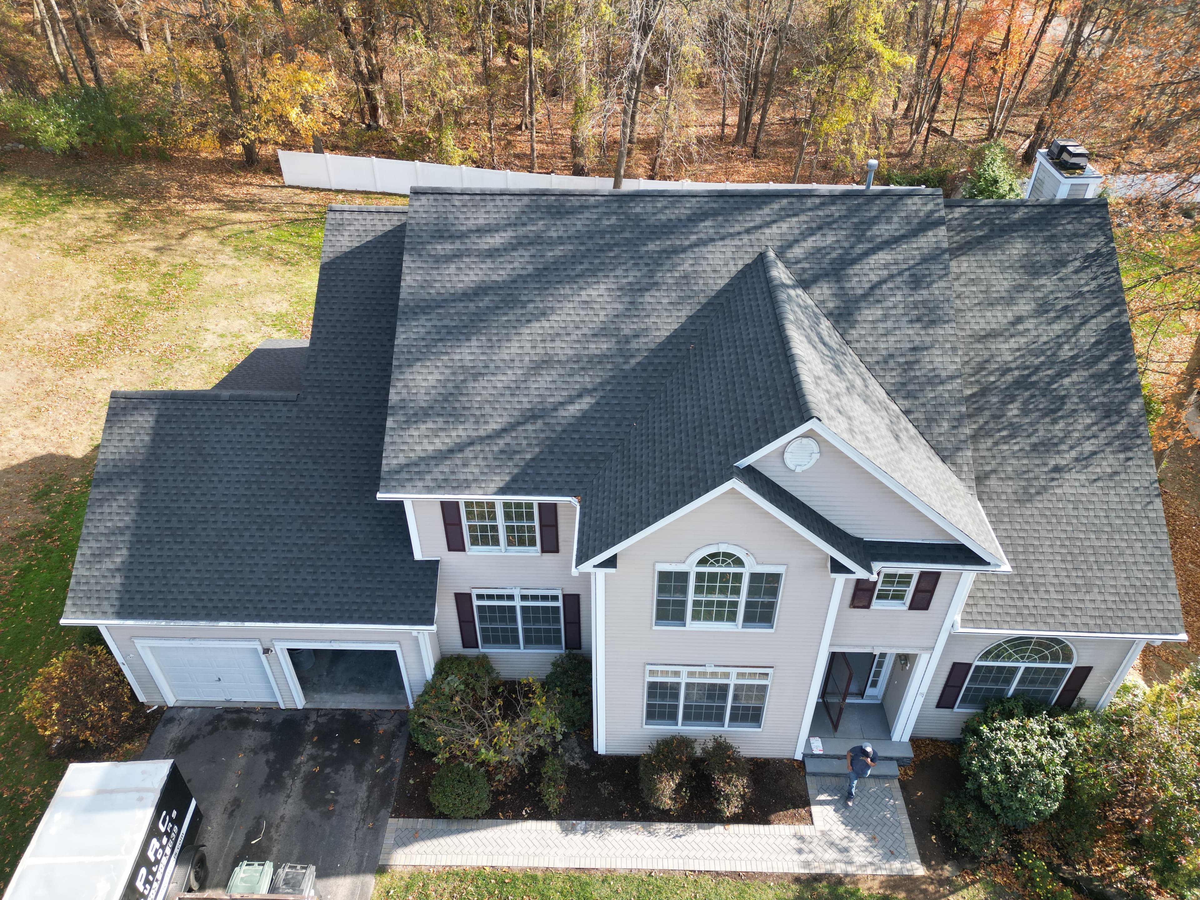 Completed roof replacement project in Milford CT showing new architectural shingles from aerial view