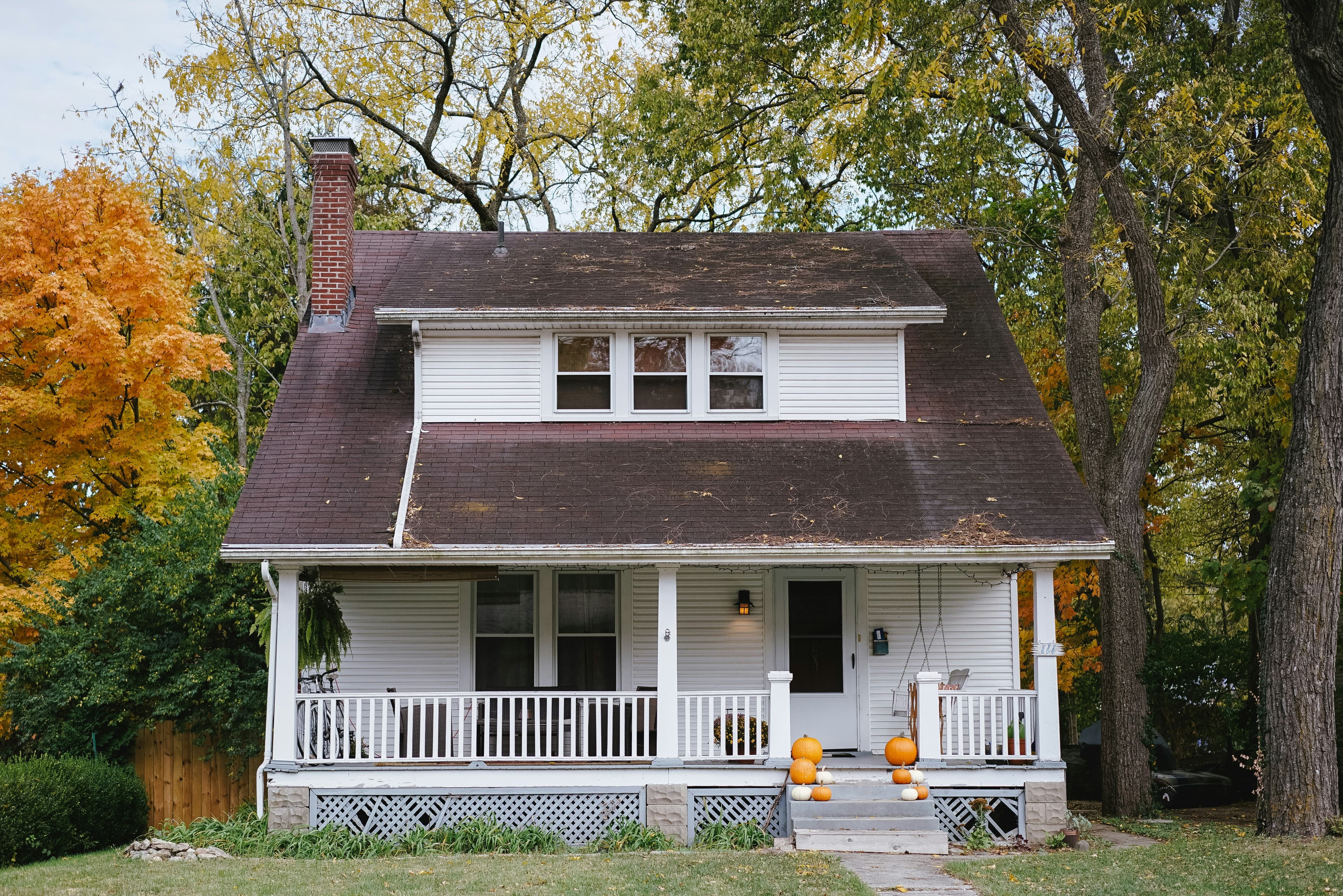 Damaged roof shingles showing signs of replacement needed