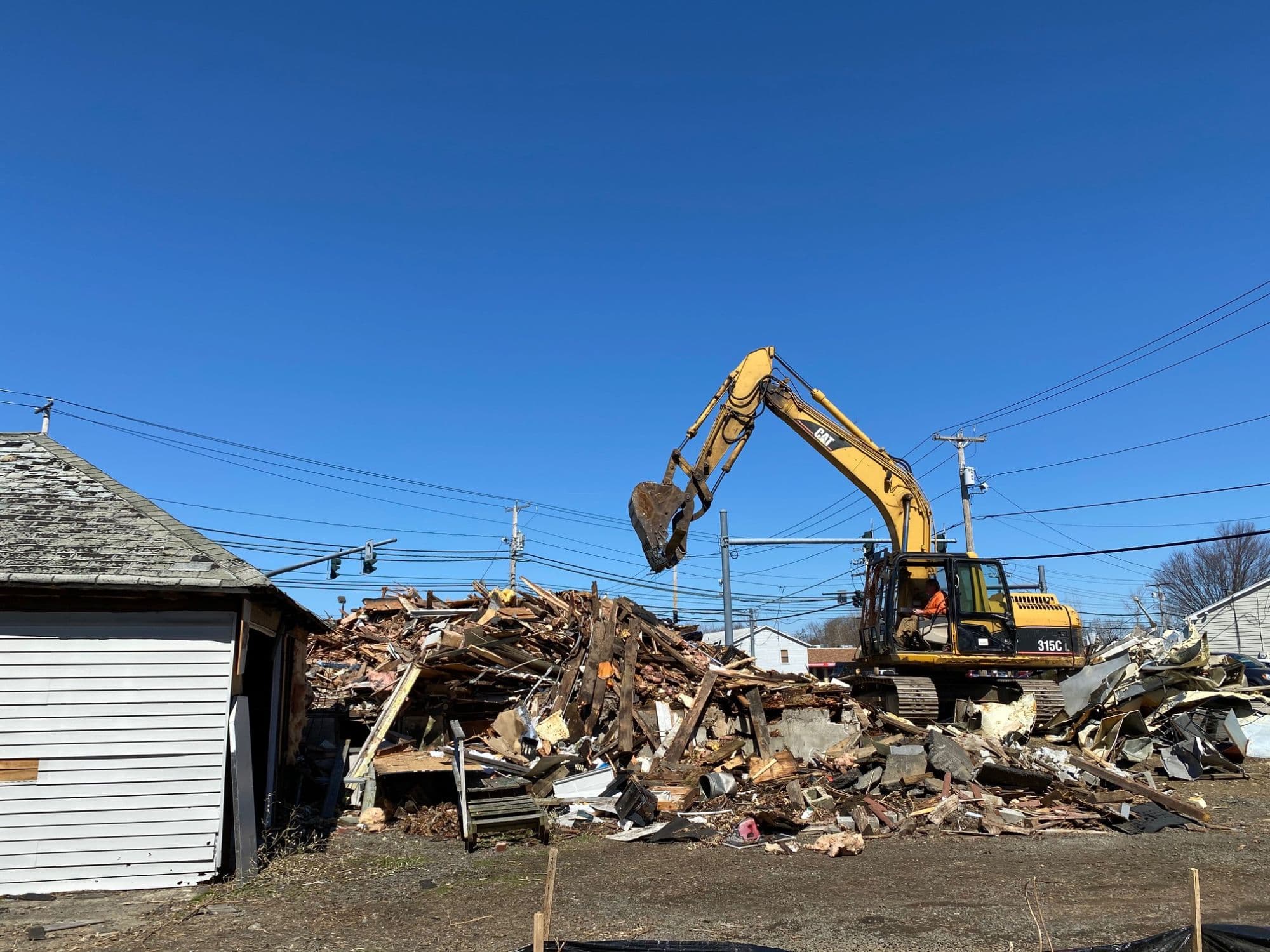 Excavator performing a residential teardown in Milford CT